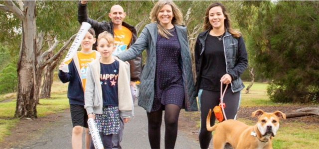 Family participating in the 6k for Water challenge with their children and dog